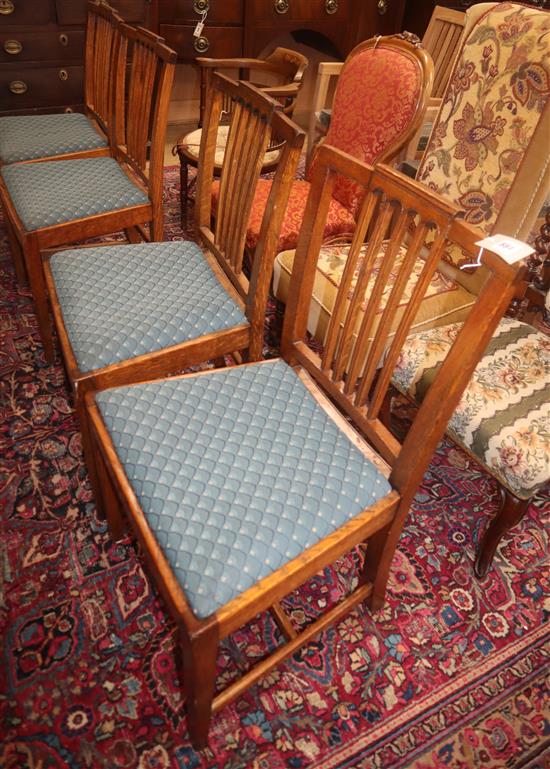 A set of four Sheraton style oak dining chairs, by Waring & Gillow